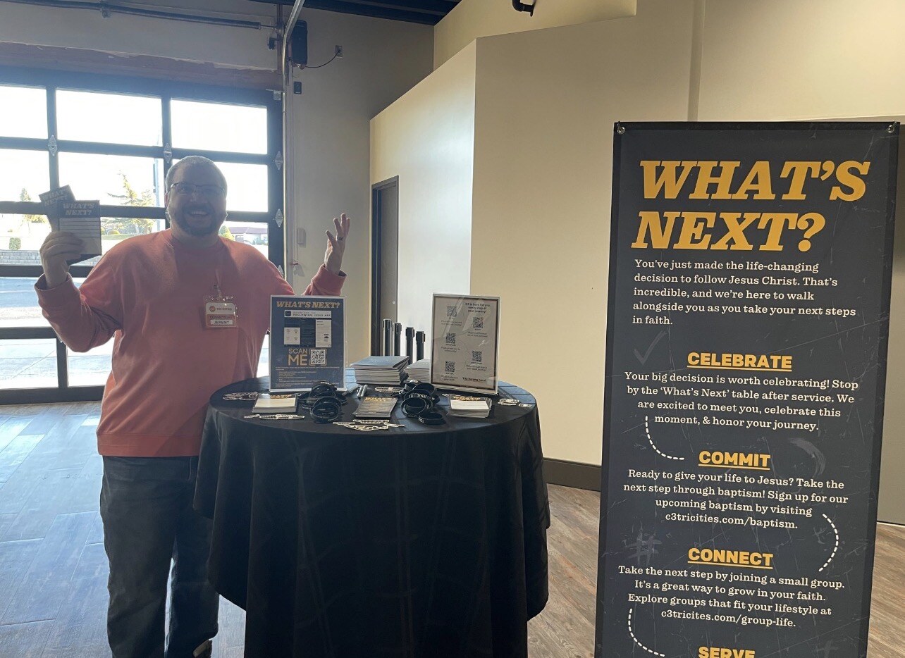 Jeremy Filbert staffing the What's Next connection booth